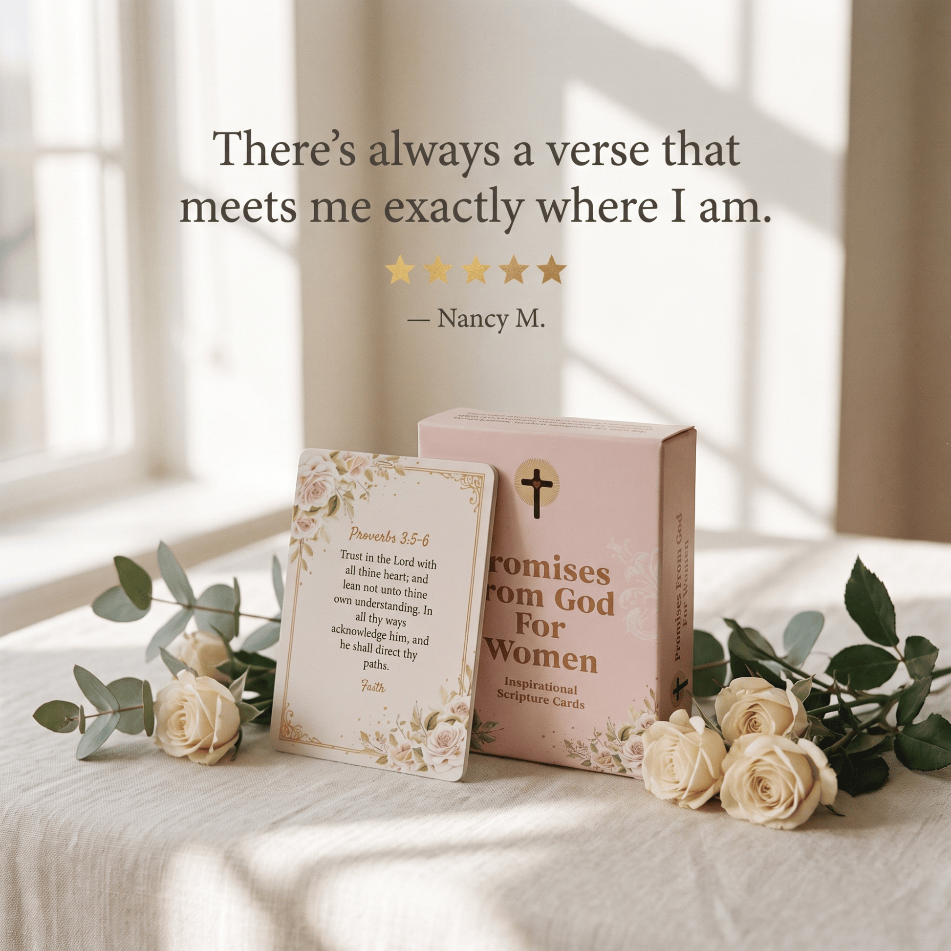 A boxed card set and a single card displayed on a light fabric surface with flowers and a softly lit interior background. The box is pale pink with a gold cross and the text 'Promises from God For Women'; the card reads 'Promises 3:8' with a scripture quote.