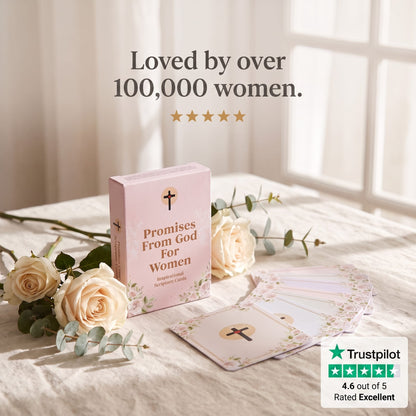 A pink card deck box labeled 'Promises From God For Women' sits on a bed with cream roses and greenery. A fanned-out set of cards is placed in front, with text above reading 'Loved by over 100,000 women.
